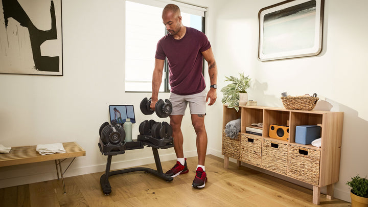 BowFlex SelectTech Adjustable Dumbbell Stand - Man Using Stand