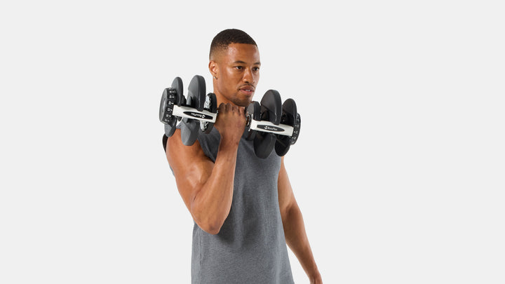 BowFlex Results Series 90 SelectTech Dumbbells - Man doing a curl with dumbbell