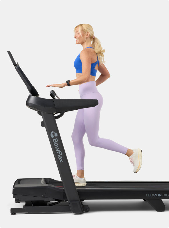 Woman running on the BowFlex T16 Treadmill.
