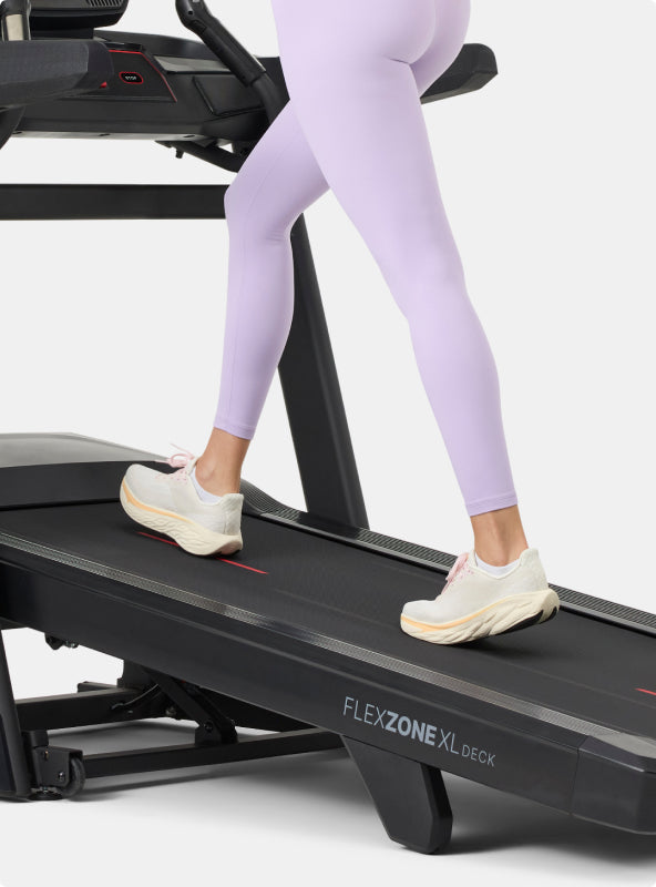 Person walking on the BowFlex T16 Treadmill Flex Zone Deck.